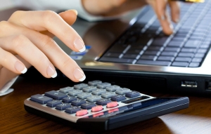 Image-of-calculator-being-used-by woman-for-taxes